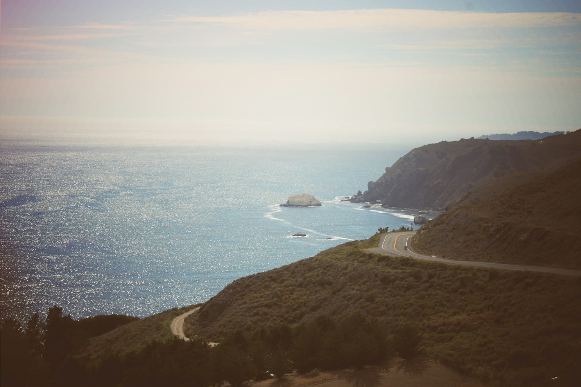A road winding along the California coast above the Pacific